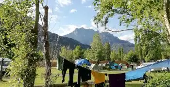 campsite set in valley of mountains